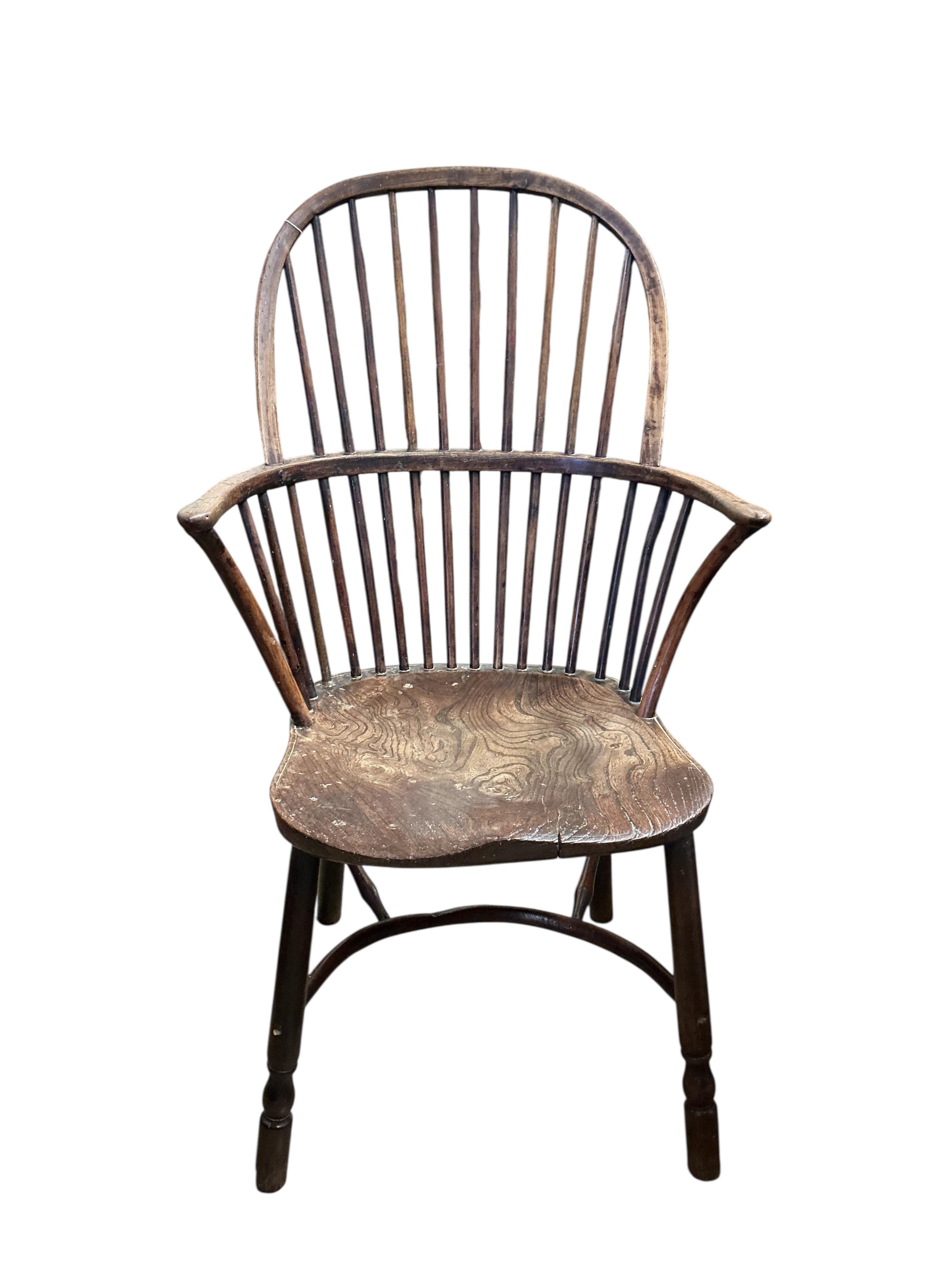 A 19th century ash, elm and beech Windsor comb back with crinoline stretcher armchair, width 57cm, depth 43cm, height 102cm